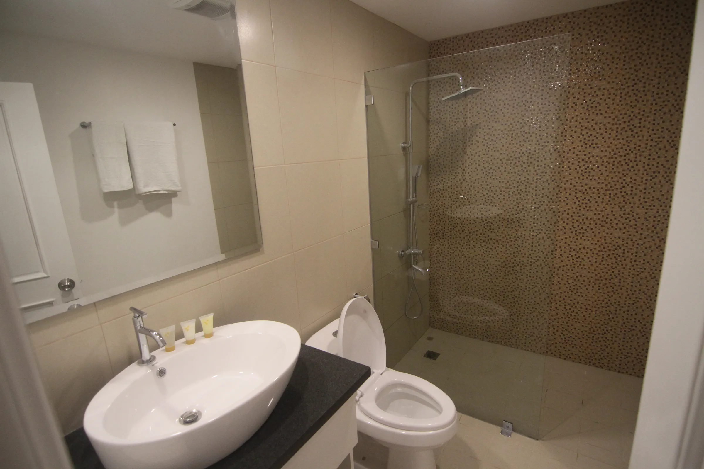 Bathroom with a vessel sink and toilet.