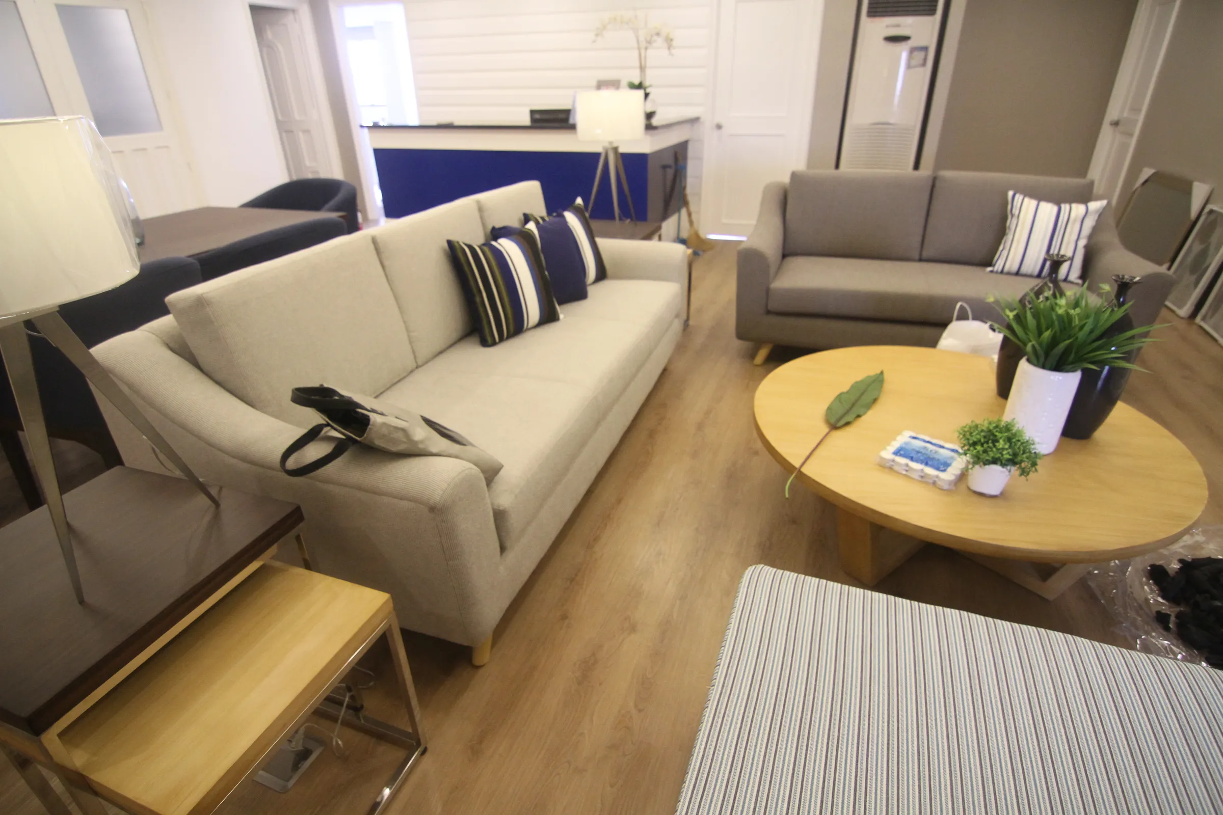 Suite living area with a sofa and soft lighting.
